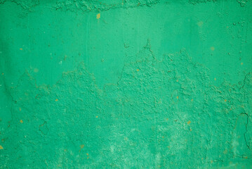 the texture of an old green painted wall. rough background.