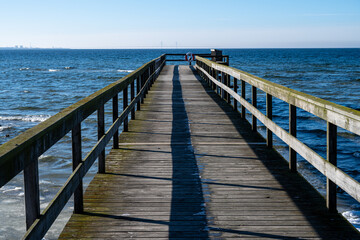  A picture of a boardwalk in an Ice covered ocean bay. Picture from Lomma, southern Sweden