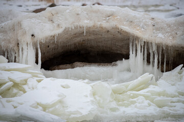 Ice formations at Baltic sea coast. Full of ice winter sea coast in Europe. Natural outdoor seascape with frozen ice formations. Ice covered Baltic sea coast. Frozen ice on a sunny day. Scenic view