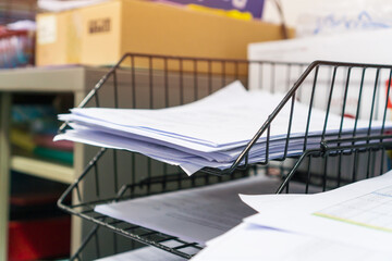 Stack of paper documents rack files on wireframe filing tray, information of finance on high work desk office, commercial report papers or piles of unorganized project achieves, Busy Business concept