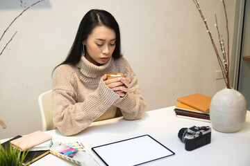 Cropped shot of two UI developers meeting on their project with paperwork and tablet on meeting...