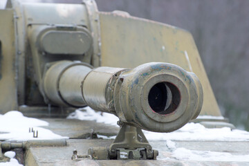 Artillery barrel close-up. Military vehicle for shooting. Prohibition of wars.