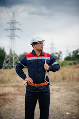 An energy worker inspects power lines. Energy