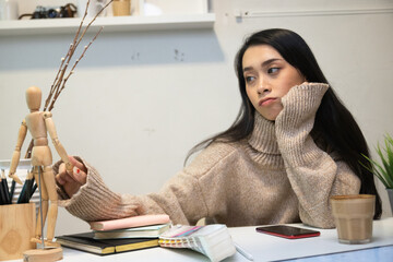 Cropped shot of two UI developers meeting on their project with paperwork and tablet on meeting...
