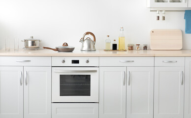 Contemporary scandinavian home interior, cozy kitchen design with utensils and apartment for rent