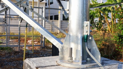 Gray ground bar on metal poles. Grounding point on the connection pole of a wireless...