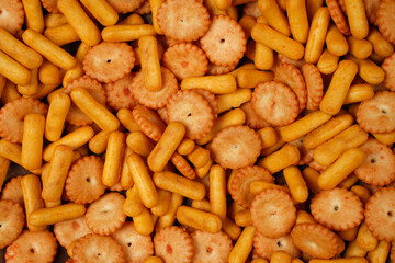 Biscuits are a crunchy snack product made by baking them. Several types of biscuits are arranged in unique formations to create a beautiful image that is suitable as a background. Wallpaper biscuits.