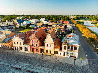 Beautiful aerial view of the market square of Kedainiai, one of the oldest cities in Lithuania. Unique colorful Stikliu houses in golden sunset light.