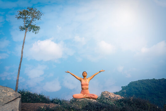 Yoga Life Balance Woman Exercise. Girl adventure fit practicing yoga pose balance body vital zen meditation in nature sky mountains Landscape