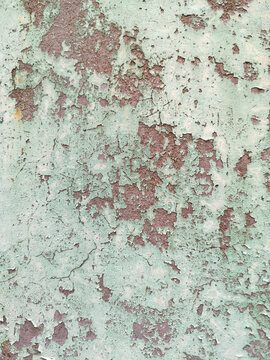 Rusty metal texture with light green painting background
