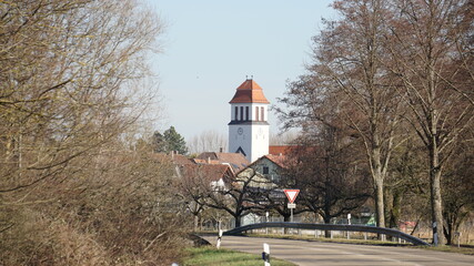 the road from Elchesheim to Wuermersheim with the view of the Herz-Jesu-Kirche (Heart-Jesus-Church)...