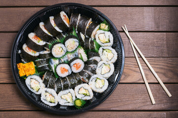 Sushi zuko maki with shrimp, cheese, cucumber and black masago caviar. Homemade dragon roll, japanese food.