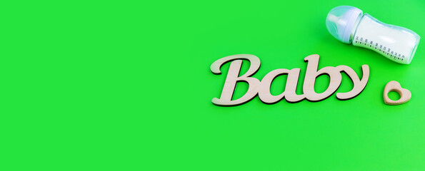 lettering baby on a green background