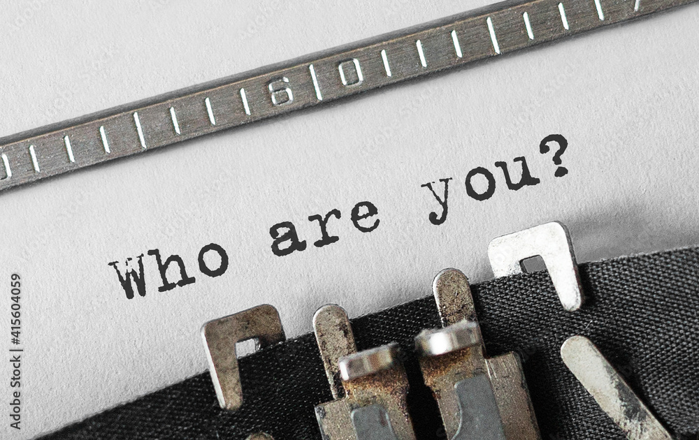 Poster text who are you typed on retro typewriter