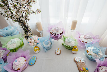 Beautiful Easter cakes on a decorated light table. A light holiday of Easter.