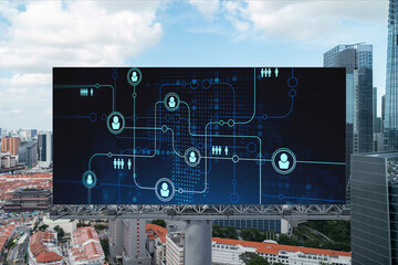 Glowing Social media icons on road billboard over panoramic city view of Singapore, Southeast Asia. The concept of networking and establishing new connections between people and businesses.