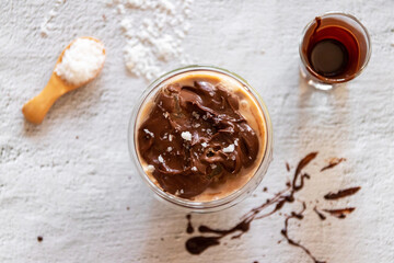 Salted dark chocolate iced coffee on white table on background. Top view.