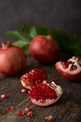 Fresh ripe pomegranate on a wooden background