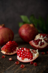 Fresh ripe pomegranate on a wooden background