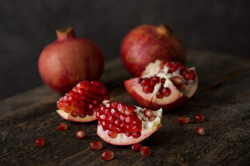 Fresh ripe pomegranate on a wooden background