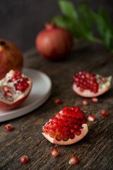 Fresh ripe pomegranate on a wooden background