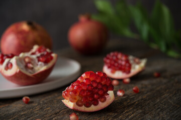 Fresh ripe pomegranate on a wooden background