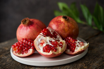 Fresh ripe pomegranate on a wooden background