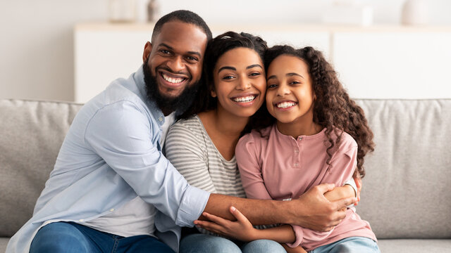 Portrait of a happy black family smiling at home