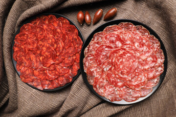 Servings of chorizo and 100% acorn-fed Iberian salchichón from Extremadura decorated with acorns