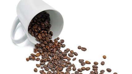 Roasted coffee beans fall from a lying coffee cup isolated on white background