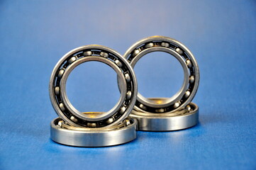 Roller bearings on a blue background. Car spare parts.