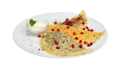 Kutaba pastries with different fillings and sauce on white round plate isolated