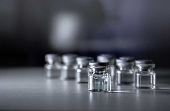 Vaccine prototype Bottle of covid-19 and Syringe. Coronavirus Vaccine in laboratory, hospital or pharmacy. Medicine bottle for injection . Drug Ampoule Mockup. Vaccination concept.