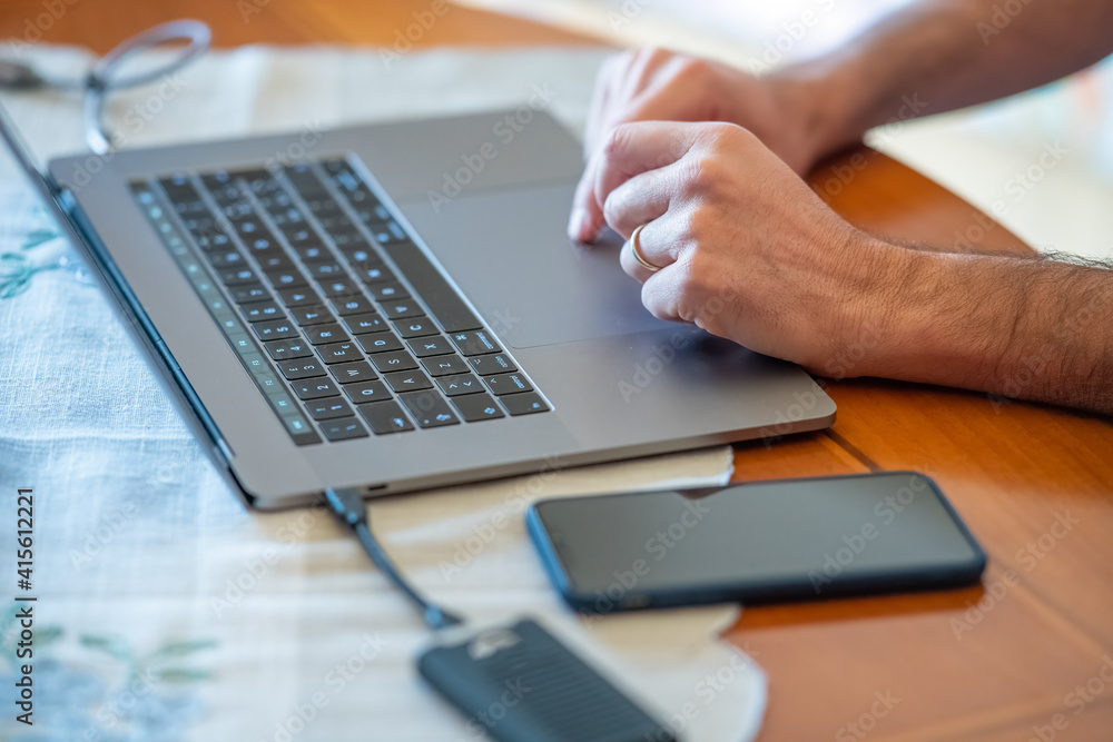 Poster man using laptop computer at home