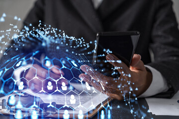 African American businesswoman signing the contract to boost her career and gain new opportunities in personal growth. Checking the detail of the deal at smartphone. Social media hologram icons