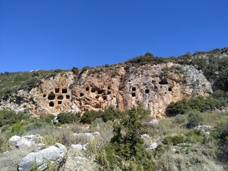 Fototapeta na wymiar Kalkan Islamlar Village Lycian Rock Tombs at location Kas Antalya