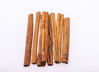 Cinnamon sticks, classic spice from the inner bark of tropical Asian trees, flavorful and aromatic for cooking, baking, health food and medicinal uses.