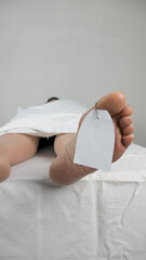 close up of the feet of dead body after autopsy possibly deceased from covid-19