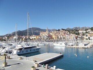 Harbor of Menton, France, with the old town in the background