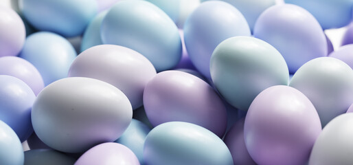 Easter eggs painted in pastel colors background