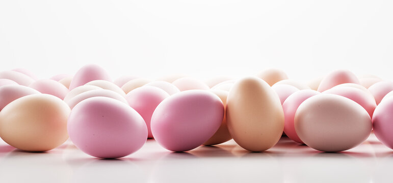 Easter eggs painted in pastel colors on white background