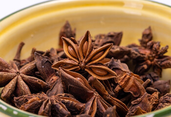 Star anise in a vintage ceramic bowl