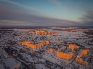 rising sun illuminates the beautiful home town shackled by frost