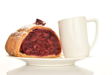 Hot cherry roll with a  coffee cup on a white ceramic saucer, on a white background.