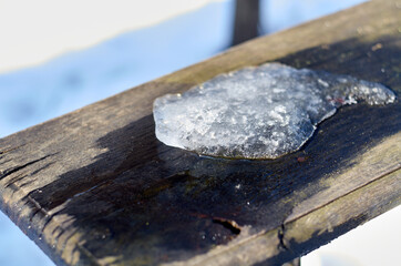 Photo of melting snow on the wood