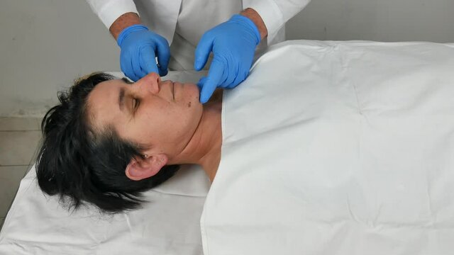 close-up of a corpse being autopsied possibly deceased from covid-19