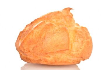 One appetizing chouquettes close-up, on a white background.