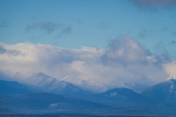 The Olympic mountains of Washington State with Puget Sound in the foreground.