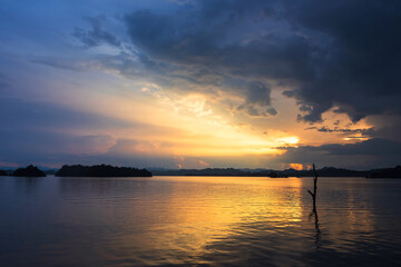 Fototapeta na wymiar Rays of sunset at reservoir, Kanchanaburi