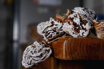 a bunch of dried sugar persimmon fruits on the edge of the textured table